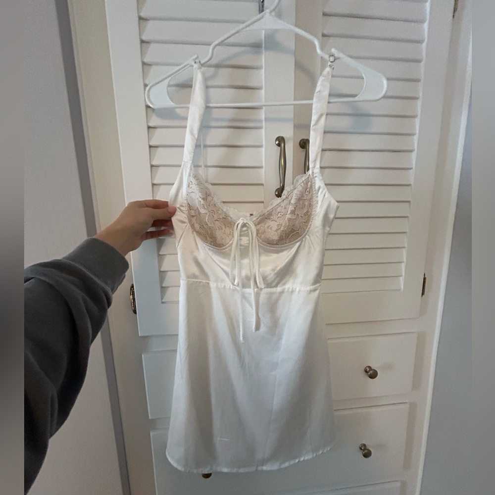 White dress with lace, there nude material under the lace so its not see through